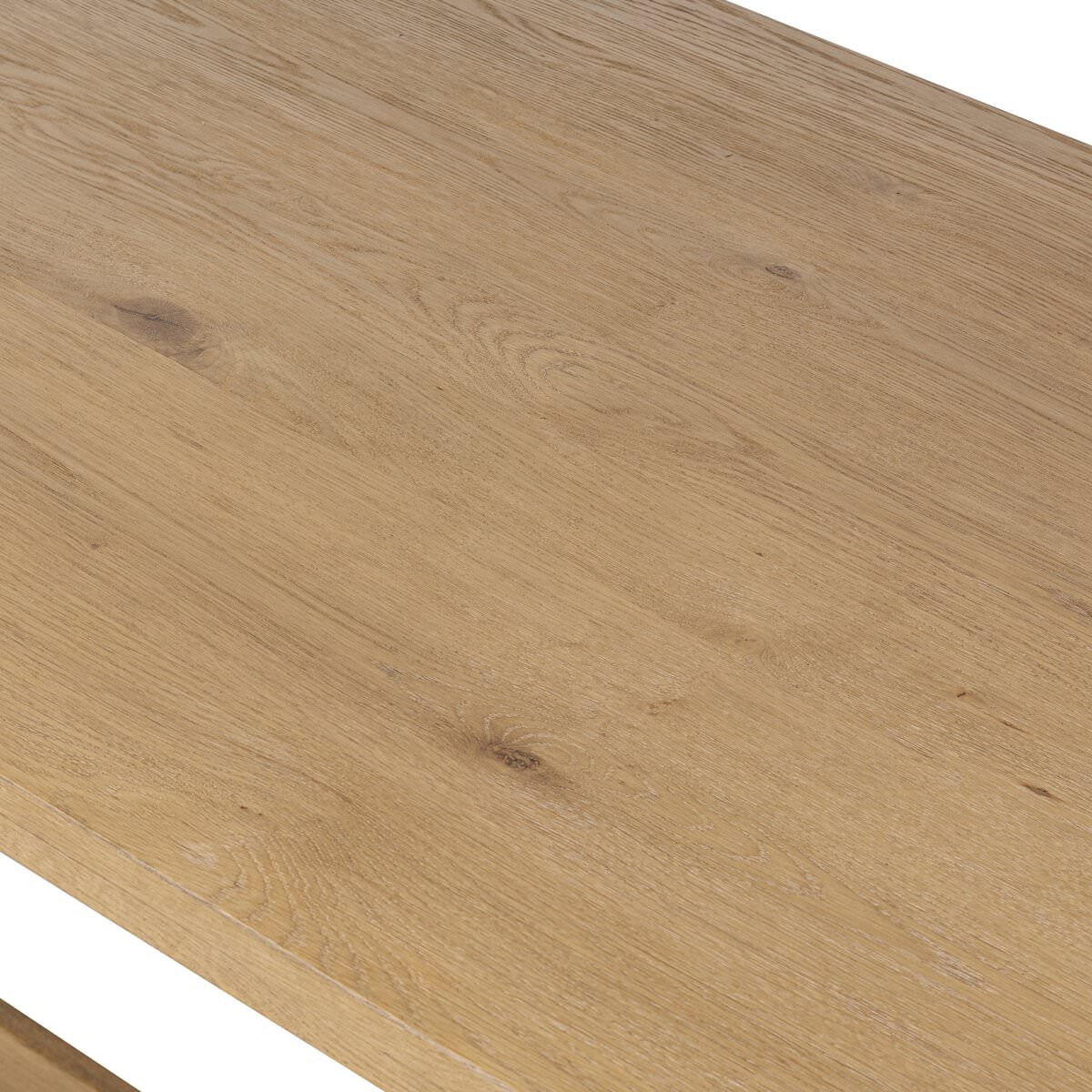 Close up of Four Hands Blinn Oval Leaf Extension Dining Table 88"-127" in Worn Oak Veneer on a white background at Addison West