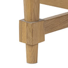 Close up of Four Hands Blinn Oval Leaf Extension Dining Table 88"-127" in Worn Oak Veneer on a white background at Addison West