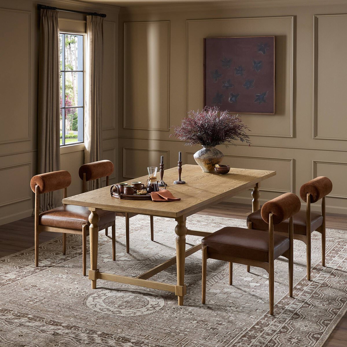 Four Hands Blinn Oval Leaf Extension Dining Table 88"-127" in Worn Oak Veneer in a beige dining room at Addison West