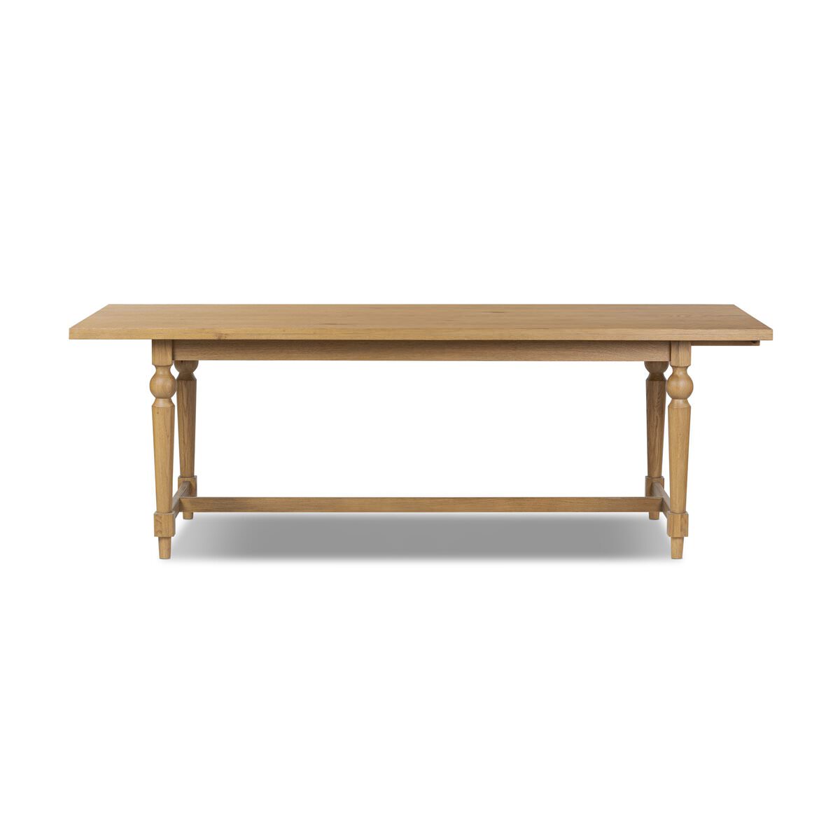 Four Hands Blinn Oval Leaf Extension Dining Table 88"-127" in Worn Oak Veneer on a white background at Addison West