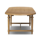 Four Hands Blinn Oval Leaf Extension Dining Table 88"-127" in Worn Oak Veneer on a white background at Addison West