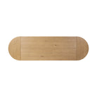 Top of Four Hands Blinn Oval Leaf Extension Dining Table 88"-127" in Worn Oak Veneer on a white background at Addison West