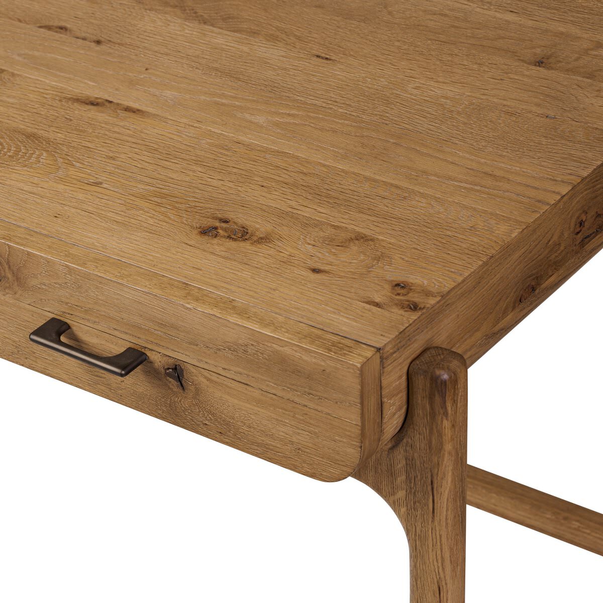 Close up of Four Hands Bloomfield Desk in Resawn Worn Oak on a white background at Addison West