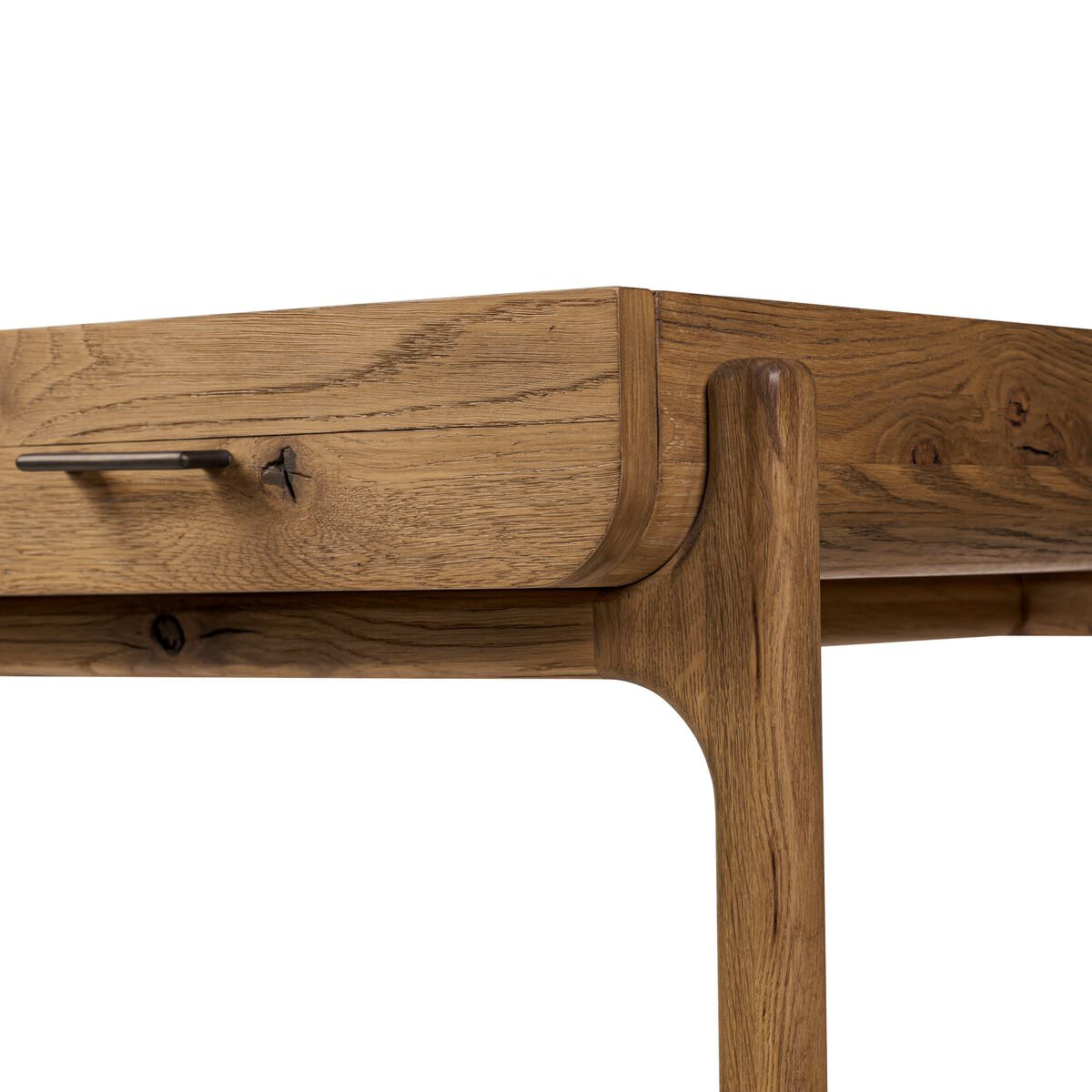 Close up of Four Hands Bloomfield Desk in Resawn Worn Oak on a white background at Addison West