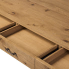 Close up of Four Hands Bloomfield Desk in Resawn Worn Oak on a white background at Addison West