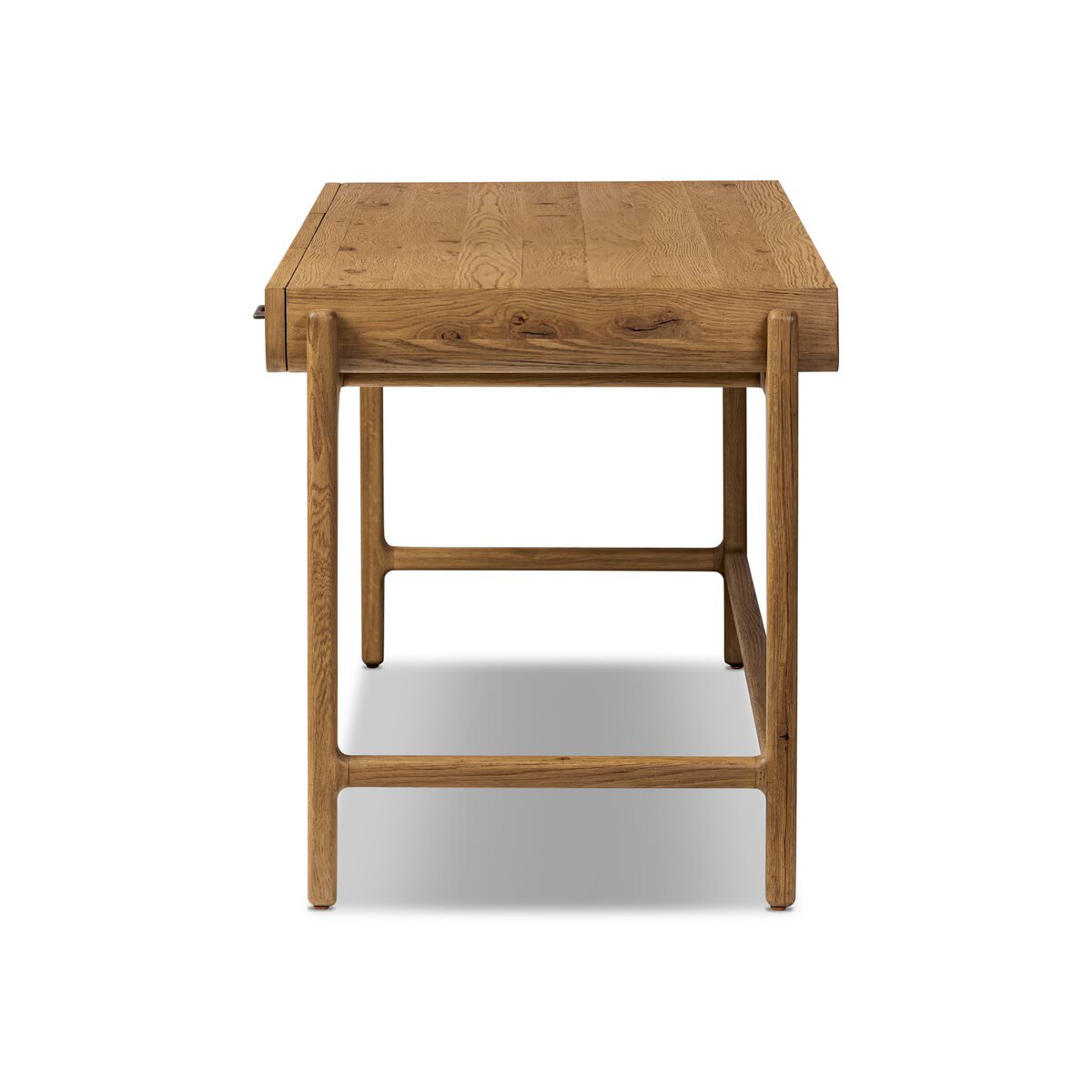 Side of Four Hands Bloomfield Desk in Resawn Worn Oak on a white background at Addison West
