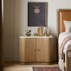 Four Hands Boa Nightstand in Cream Marble in a beige bedroom at Addison West