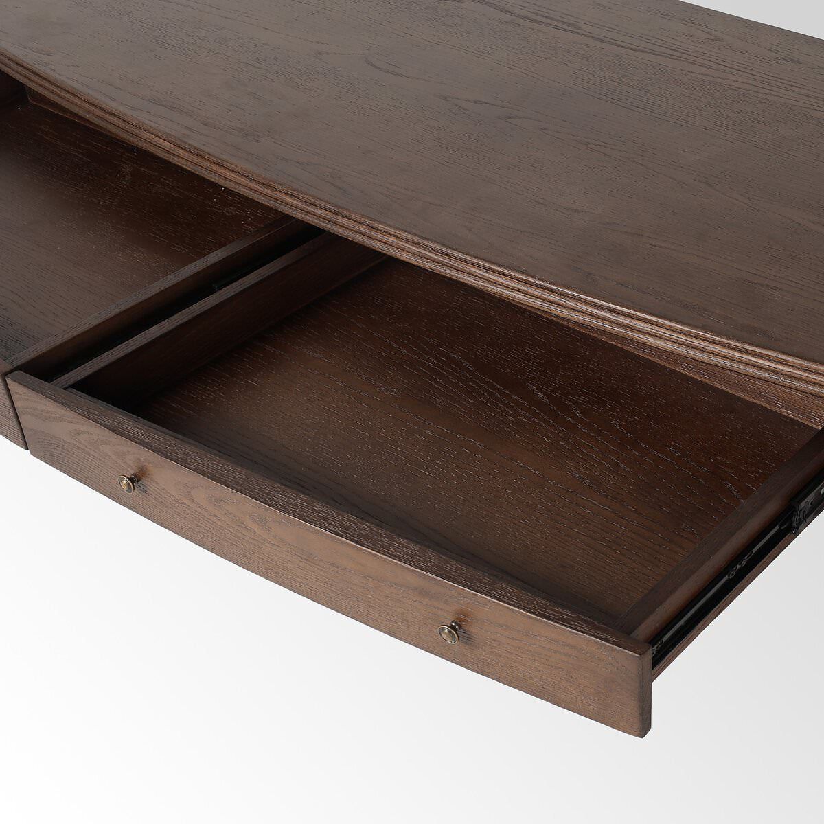 Close up of Four Hands Bowfront Desk in Drifted Oak Veneer on a white background at Addison West