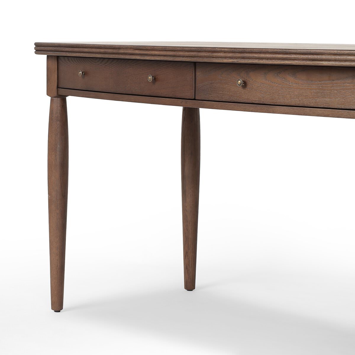 Close up of Four Hands Bowfront Desk in Drifted Oak Veneer on a white background at Addison West