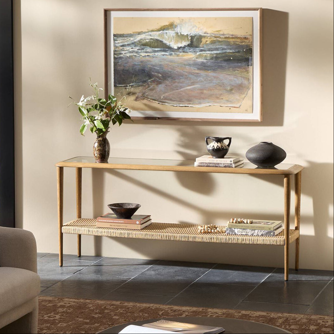Four Hands Carmelo Console Table in Tempered Glass in a living room at Addison West