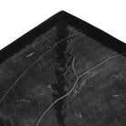 Close up of Four Hands Dalston Cast Glass Console Table in Smoked Black Cast Glass on a white background at Addison West