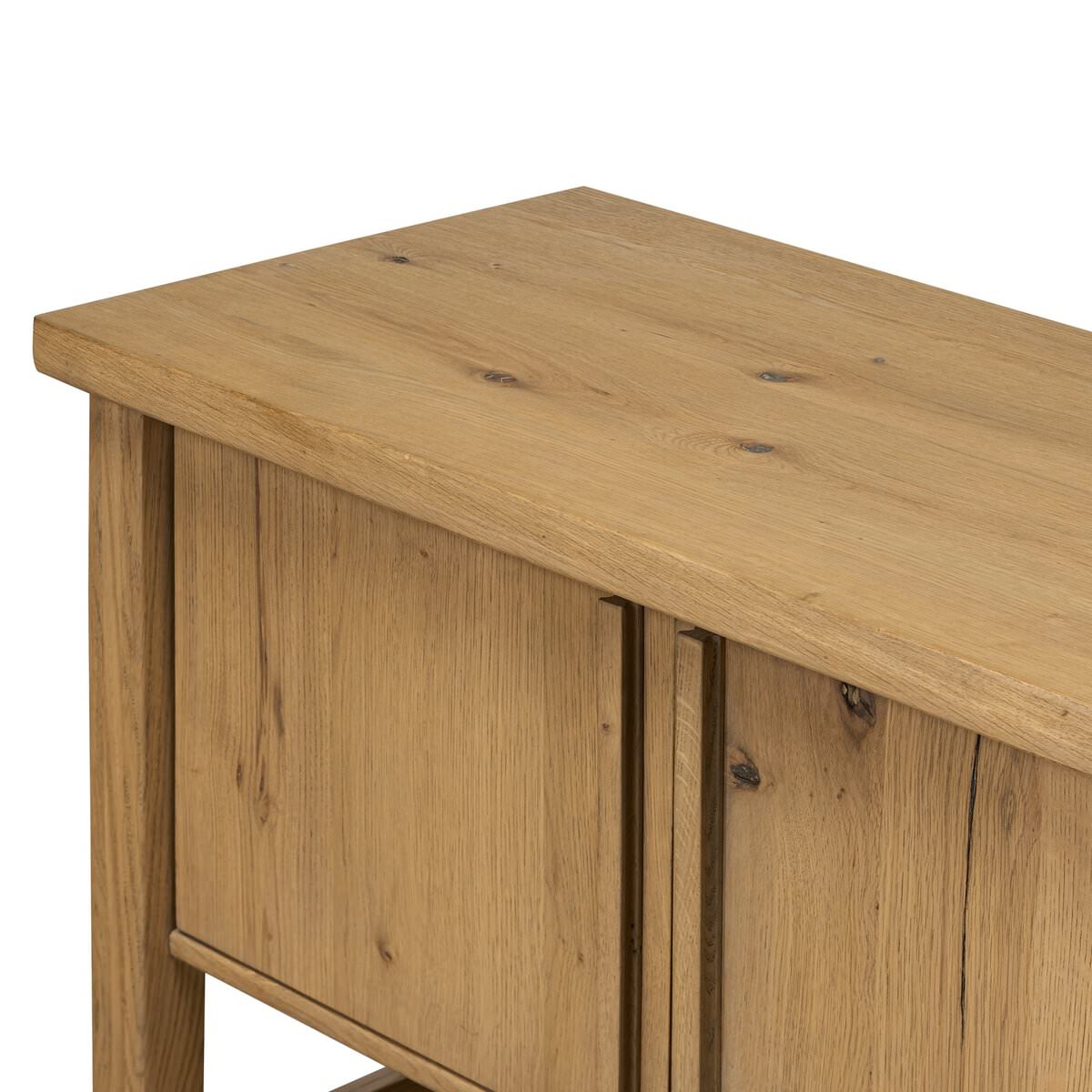 Close up of Four Hands Dalton Media Console in Aged Natural Oak Veneer on a white background at Addison West
