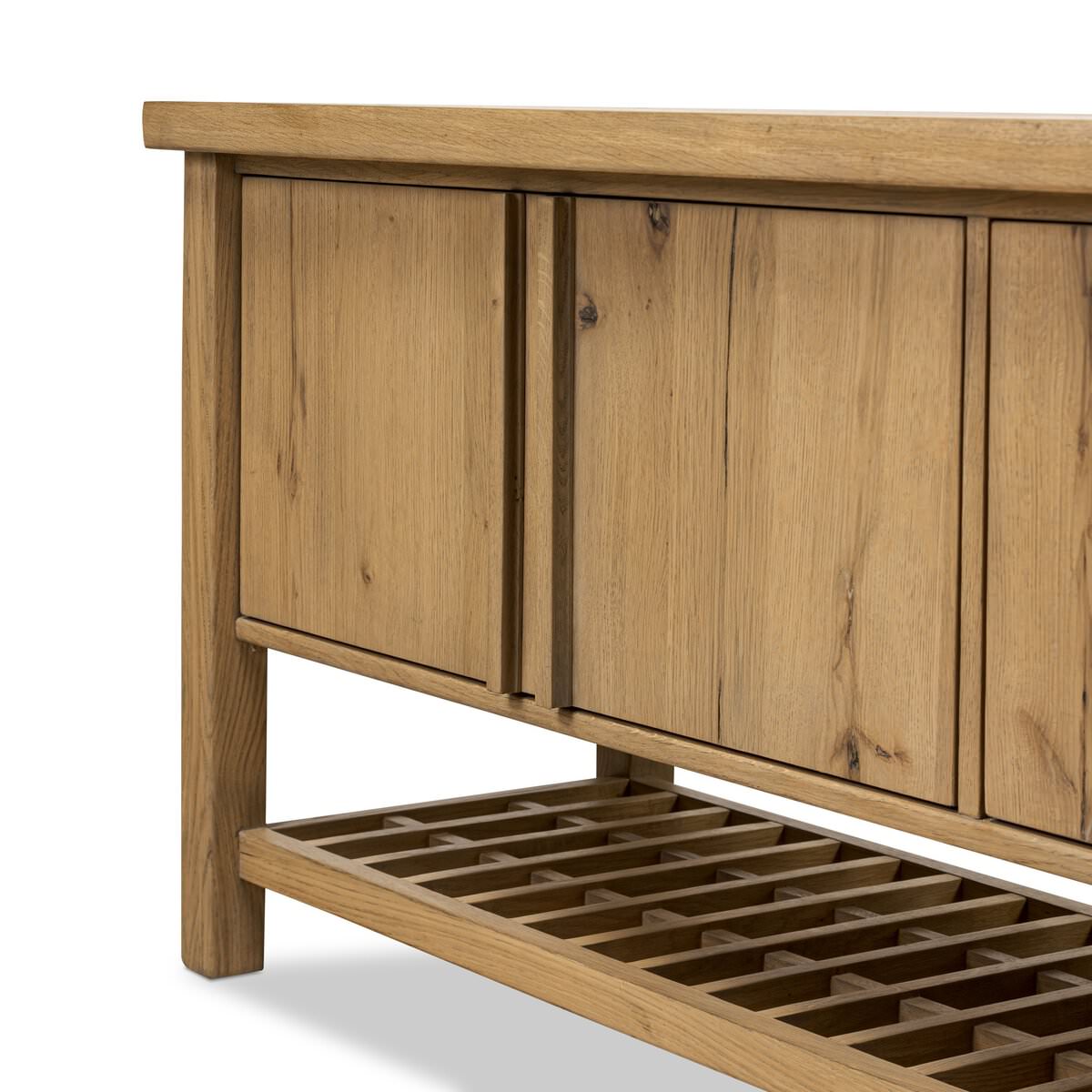 Close up of Four Hands Dalton Media Console in Aged Natural Oak Veneer on a white background at Addison West