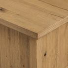 Close up of Four Hands Dalton Media Console in Aged Natural Oak Veneer on a white background at Addison West