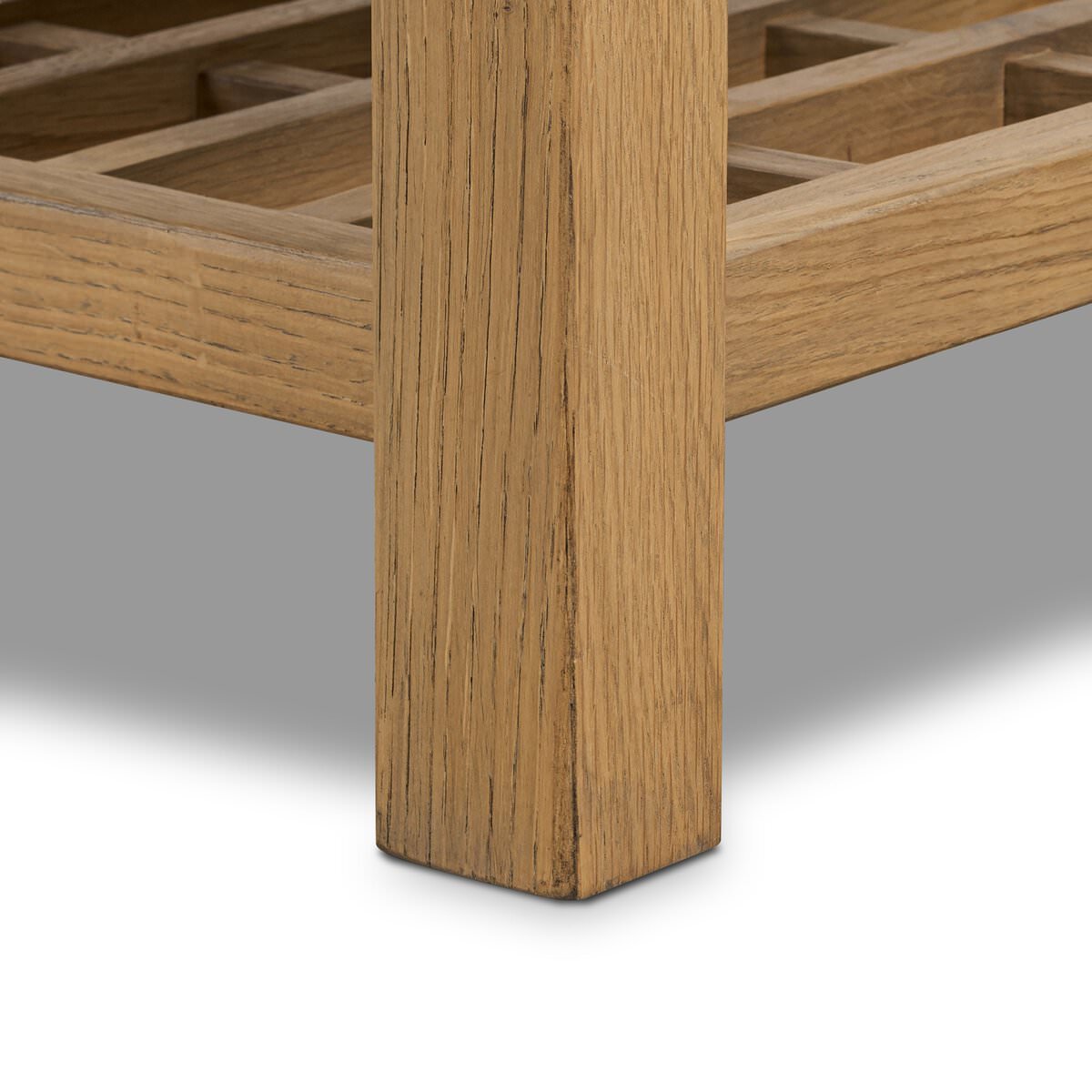 Close up of Four Hands Dalton Media Console in Aged Natural Oak Veneer on a white background at Addison West