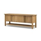 Four Hands Dalton Media Console in Aged Natural Oak Veneer on a white background at Addison West