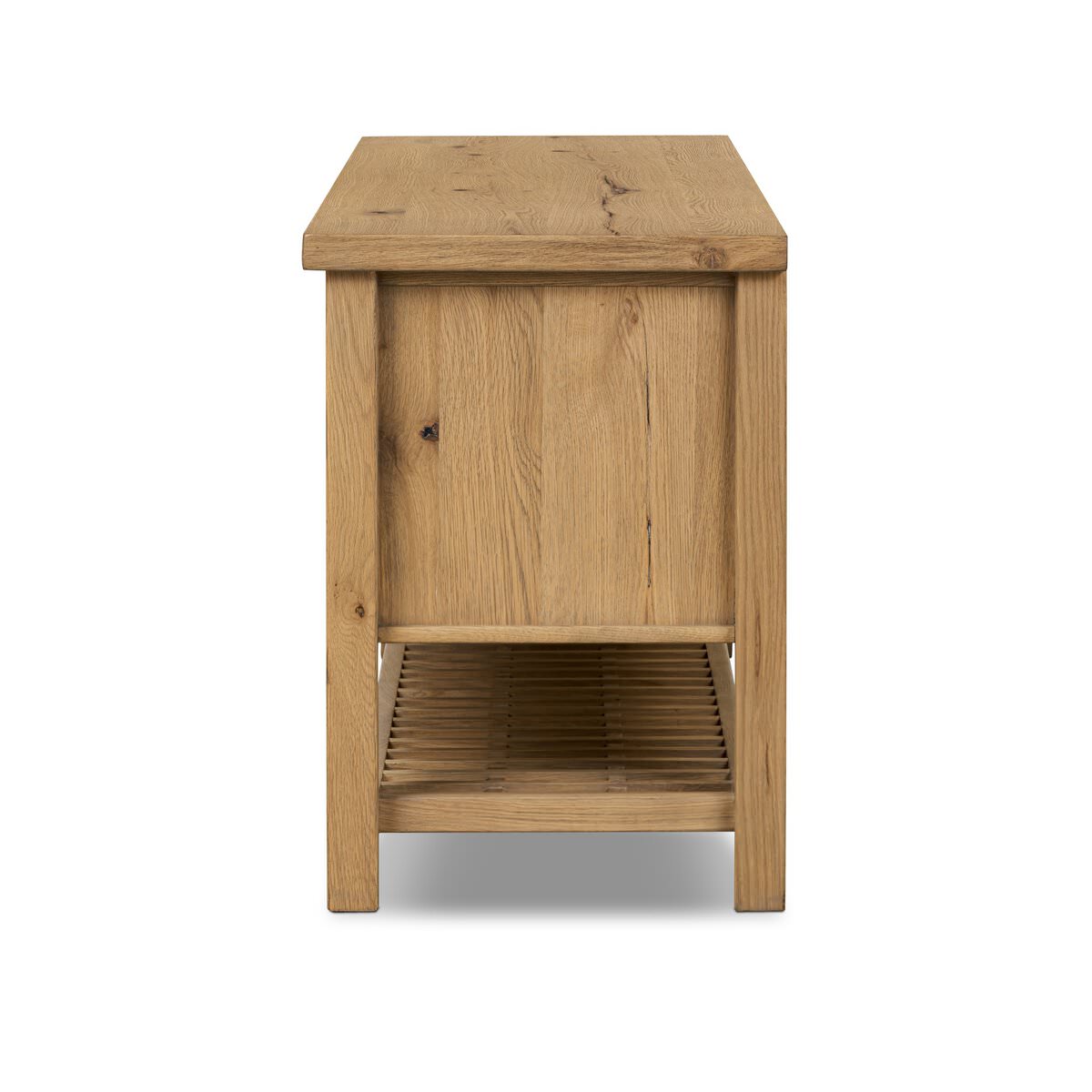 Side of Four Hands Dalton Media Console in Aged Natural Oak Veneer on a white background at Addison West
