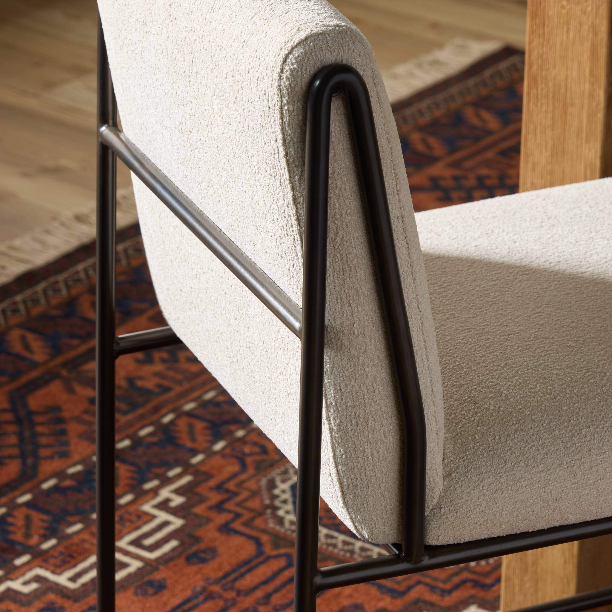 Close up of Four Hands Decker Counter Stool in Crypton Wayfarer Snow in dining room at Addison West.