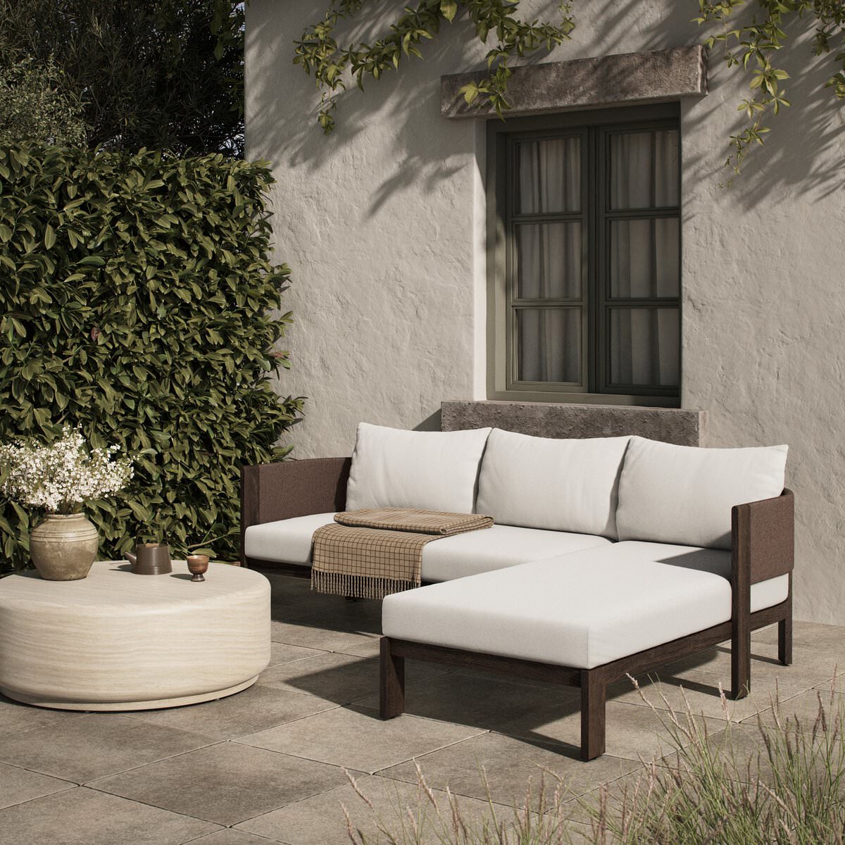 Four Hands Delancy Outdoor 2-Piece Sectional with Right Chaise in Arashi Salt on a patio at Addison West