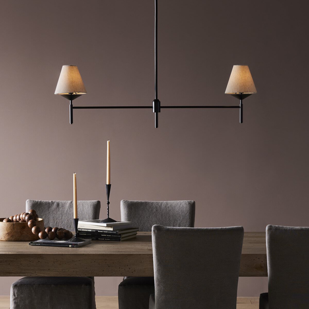 Four Hands Dodie Linear Chandelier in Jet Black in a modern neutral dining room