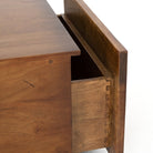 Close up of Four Hands Duncan Storage Coffee Table in Reclaimed Fruitwood on a white background