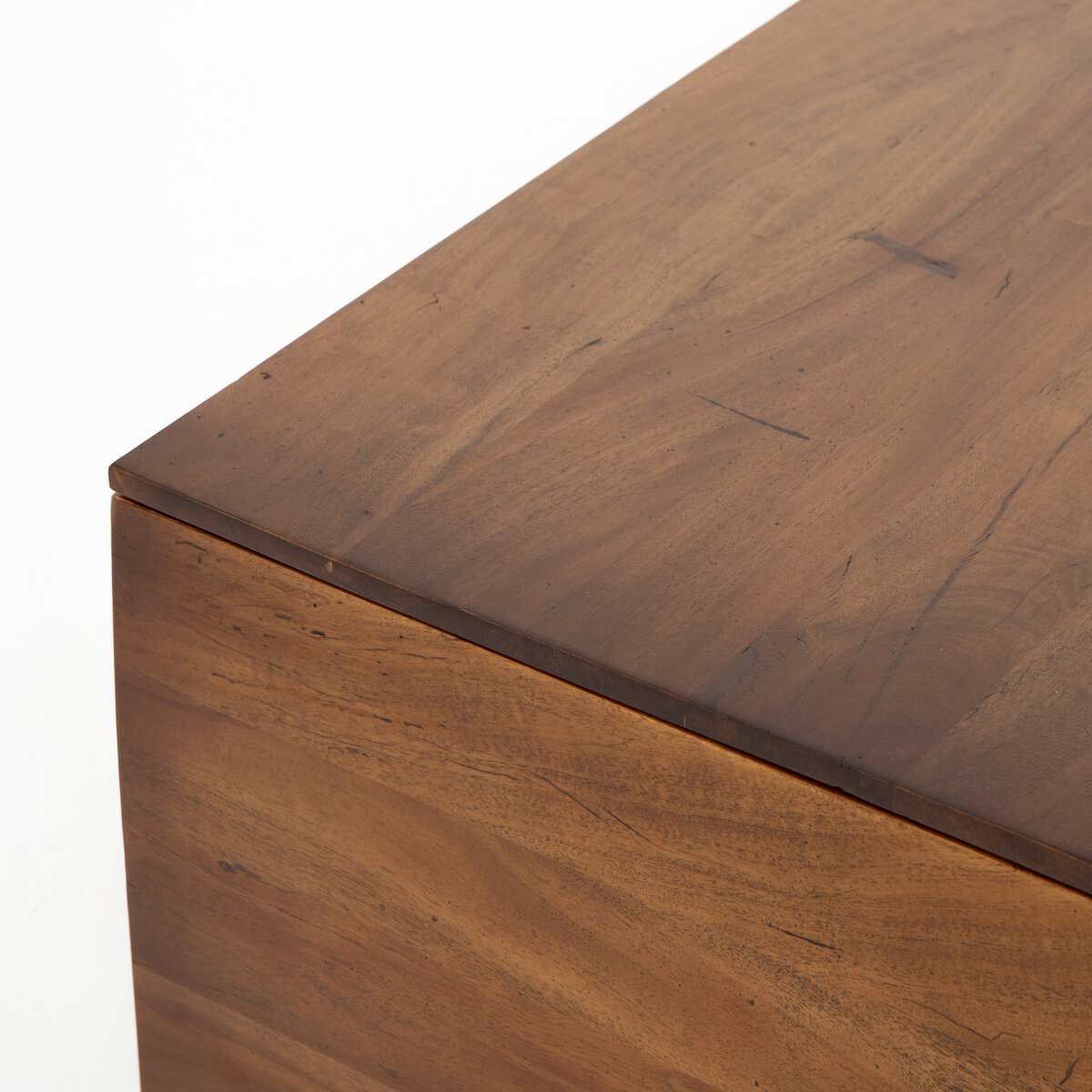 Close up of Four Hands Duncan Storage Coffee Table in Reclaimed Fruitwood on a white background