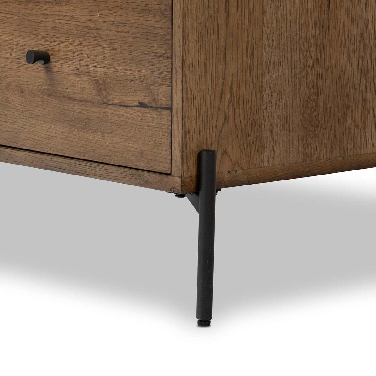 Close up of Four Hands Eaton 5 Drawer Dresser in Amber Oak Resin on a white background at Addison West