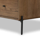 Close up of Four Hands Eaton 5 Drawer Dresser in Amber Oak Resin on a white background at Addison West