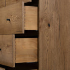 Close up of Four Hands Eaton 5 Drawer Dresser in Amber Oak Resin on a white background at Addison West