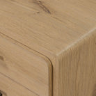 Close up of Four Hands Eden Nightstand in Aged Smoked Oak Veneer on a white background at Addison West