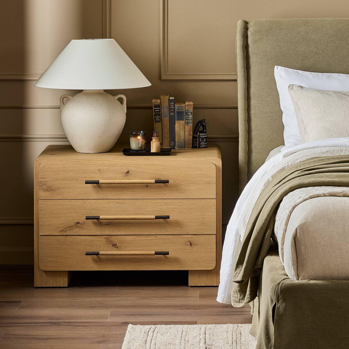 Four Hands Eden Nightstand in Aged Smoked Oak Veneer in a bedroom at Addison West