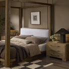 Four Hands Eden Nightstand in Aged Smoked Oak Veneer in a bedroom at Addison West