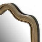 Close up of Four Hands Effie Mirror in Raw Antique Brass on a white background at Addison West