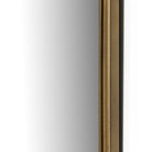Close up of Four Hands Effie Mirror in Raw Antique Brass on a white background at Addison West