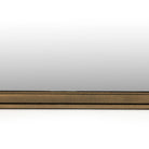 Close up of Four Hands Effie Mirror in Raw Antique Brass on a white background at Addison West