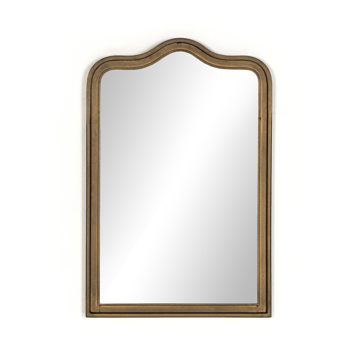 Four Hands Effie Mirror in Raw Antique Brass on a white background at Addison West