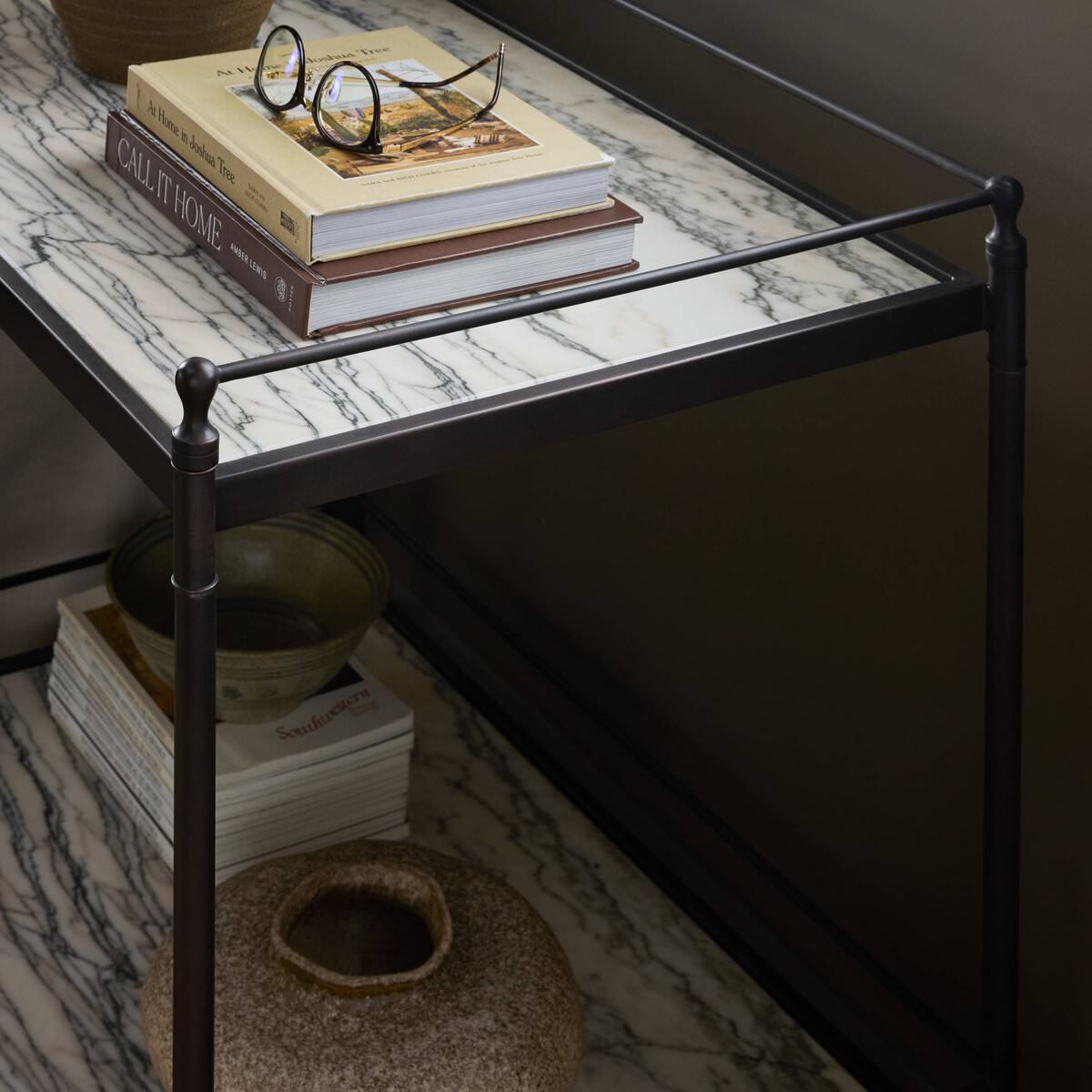 Close up of Four Hands Eisen Nightstand in Wavy White Marble in front of a beige wall at Addison West