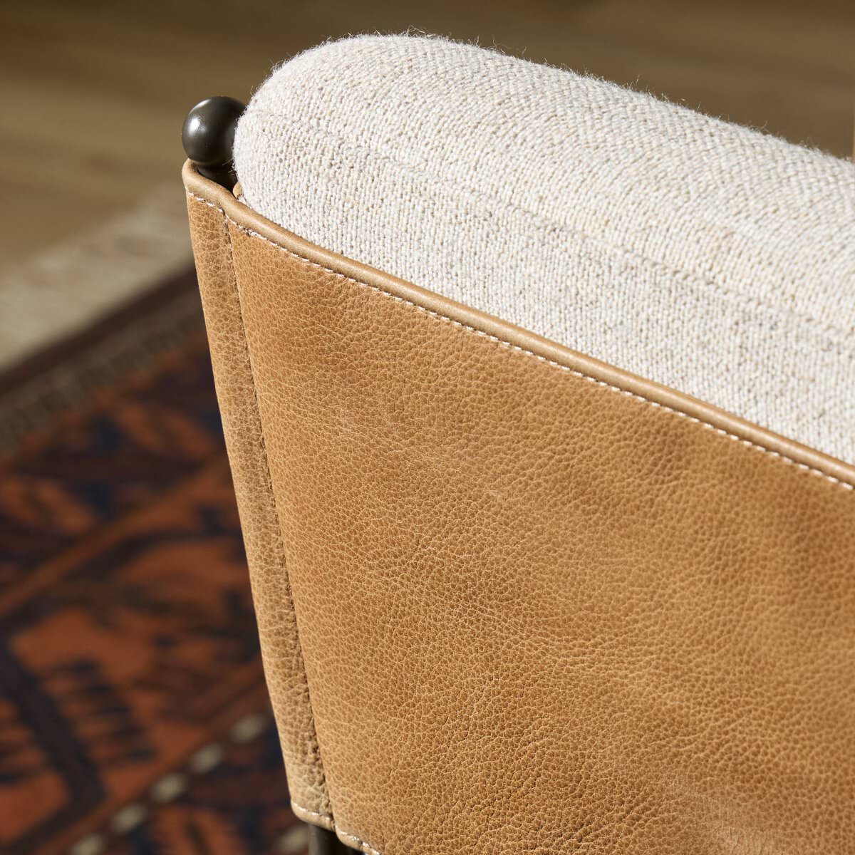 Close up of Four Hands Elba Counter Stool in Alcala Wheat in a living room at Addison West