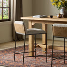 Four Hands Elba Counter Stool in Alcala Wheat in a dining room at Addison West