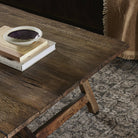Close up of Four Hands Elio Coffee Table Small in Burnt Bleached Oak in a living room at Addison West