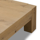 Close up of Four Hands Emmer Coffee Table in Aged Smoked Oak on a white background  at Addison West
