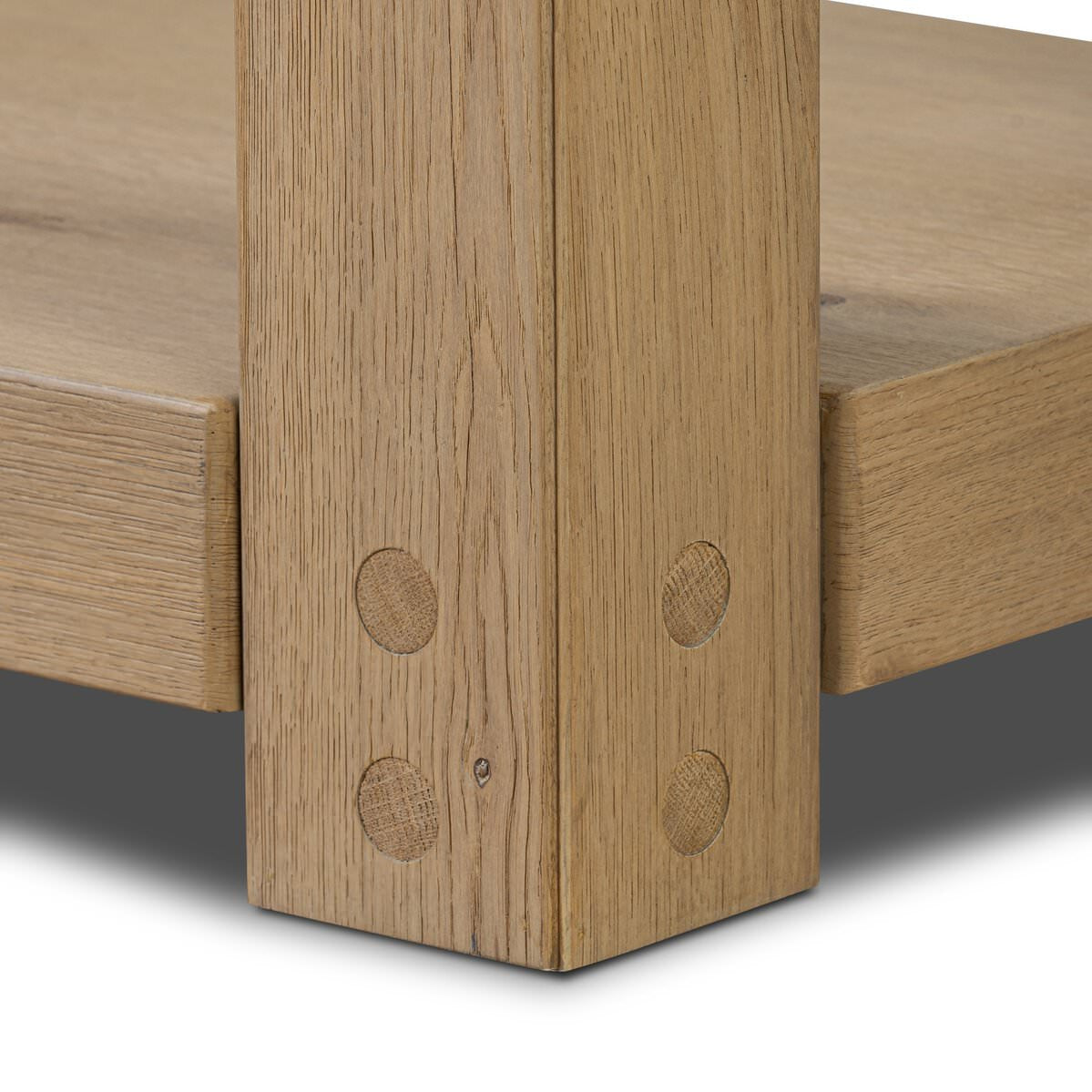 Close up of Four Hands Emmer Console Table in Aged Smoked Oak on a white background at Addison West