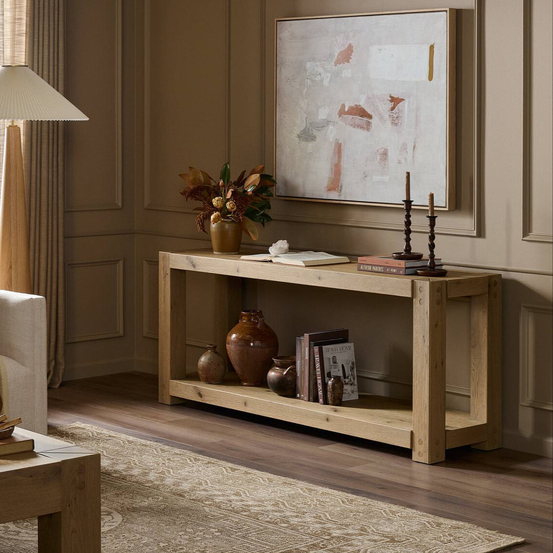 Four Hands Emmer Console Table in Aged Smoked Oak in a living room at Addison West