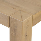 Close up of Four Hands Emmer Dining Table in Aged Smoked Oak on a white background at Addison West