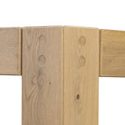 Close up of Four Hands Emmer Dining Table in Aged Smoked Oak on a white background at Addison West