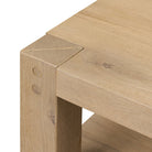 Close up of Four Hands Emmer End Table in Aged Smoked Oak on a white background at Addison West