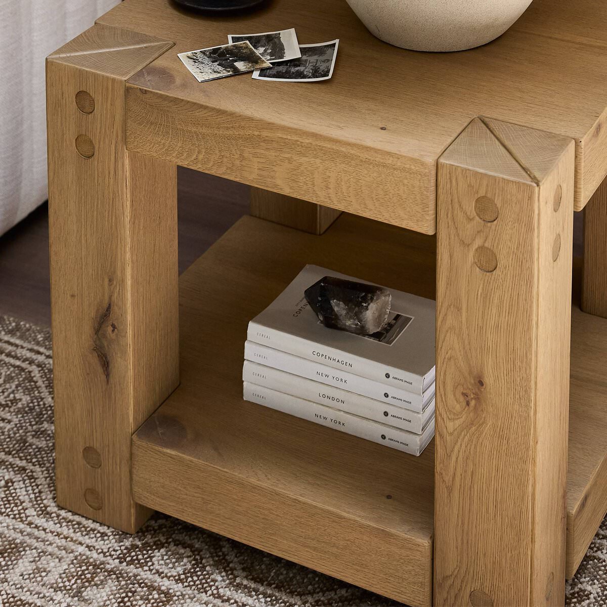 Close up of Four Hands Emmer End Table in Aged Smoked Oak in a living room at Addison West