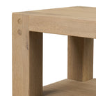 Close up of Four Hands Emmer End Table in Aged Smoked Oak on a white background at Addison West