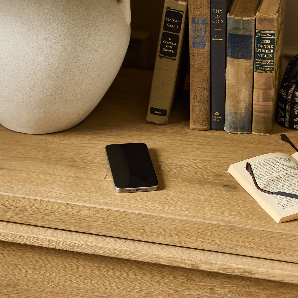 Close up of Four Hands Emmer Nightstand in Aged Smoked Oak in a bedroom at Addison West