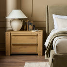 Four Hands Emmer Nightstand in Aged Smoked Oak in a bedroom at Addison West